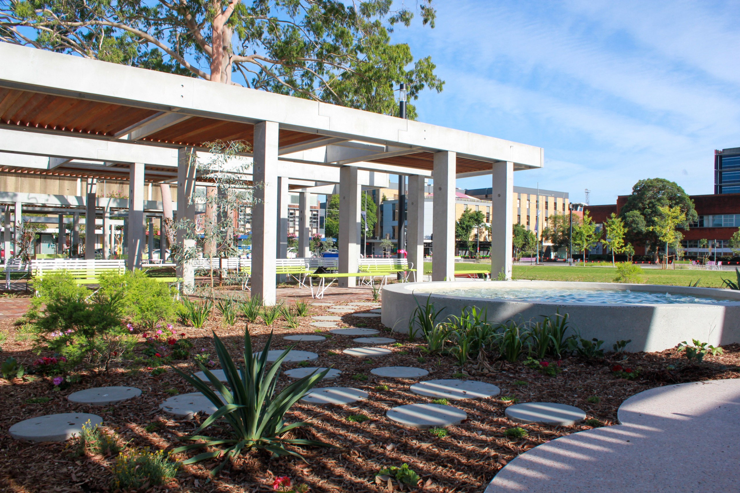 An image of a shade structure and water feature at City Park