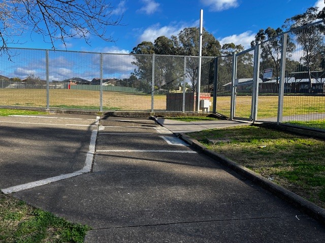 Photo of grinded down concrete at the back gate of Braddock Public School to make the pathway smooth