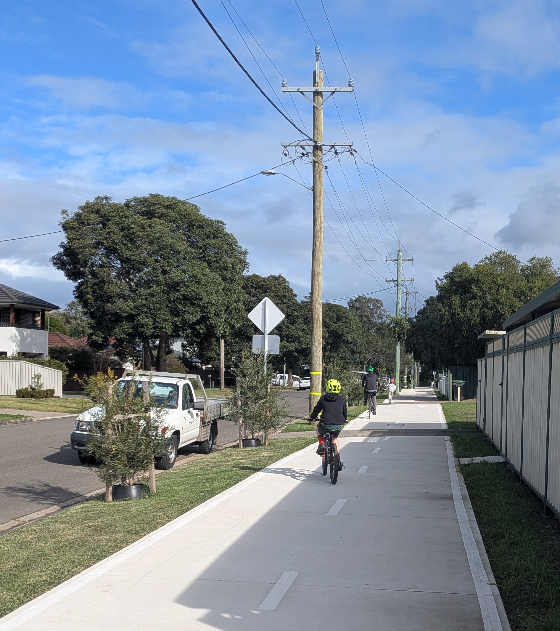 Child riding bike in Loftus Street