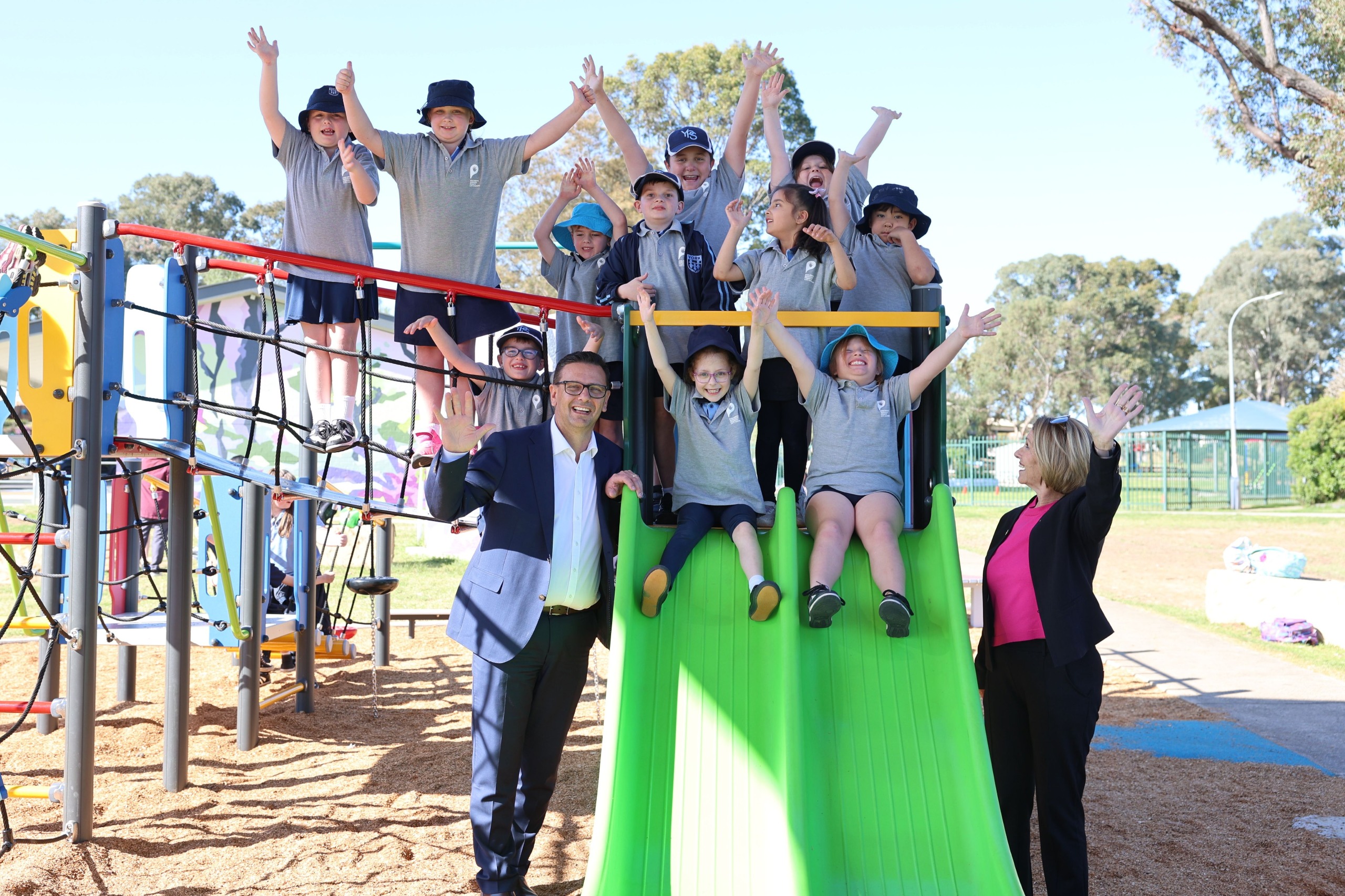 Penrith Mayor Todd Carney and Member for Penrith Karen McKeown visiting the new playspace at Eileen Cammack Reserve, South Penrith, with children from York OSHC and Tandara Children's Centre OSHC.