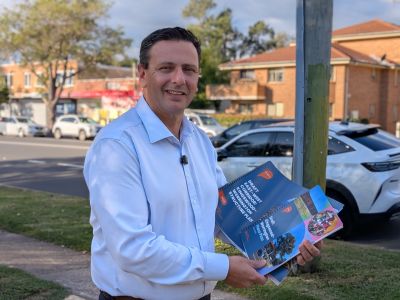 Penrith Mayor Todd Carney holding the draft Kingswood-Werrington Structure Plan and Place Plan documents
