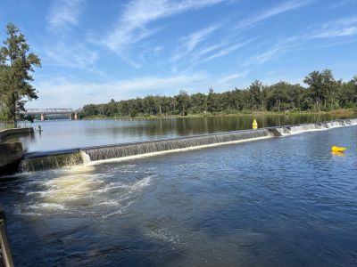 A weir on the Nepean River with water overflowing